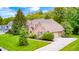 Beautiful brick home featuring a well-manicured lawn and an attached two car garage at 5404 Cayman Dr, Carmel, IN 46033