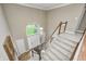 Grand two-story foyer showcases a staircase, chandelier, and transom window above the entry door at 5404 Cayman Dr, Carmel, IN 46033