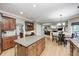 Kitchen with island seating adjacent to living room and breakfast nook at 5404 Cayman Dr, Carmel, IN 46033