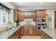 Modern kitchen with stainless steel appliances, granite countertops, and ample cabinet space at 5404 Cayman Dr, Carmel, IN 46033