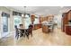 Spacious kitchen with wood cabinets, stainless steel appliances, island with seating, and adjacent breakfast area at 5404 Cayman Dr, Carmel, IN 46033
