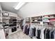 Spacious walk-in closet features custom shelving and ample storage for clothes, shoes, and accessories at 5404 Cayman Dr, Carmel, IN 46033