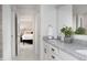 Bright bathroom with granite countertop, white cabinets, and open doorway to bedroom at 569 Dalton Way, Avon, IN 46123