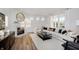 A stylish living room featuring a cozy fireplace, a plush sectional, a modern coffee table, and bright windows at 569 Dalton Way, Avon, IN 46123