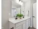 Well-lit bathroom with double sinks, a large mirror, and sleek black fixtures at 577 Dalton Way, Avon, IN 46123