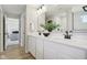 Bathroom featuring dual sinks, quartz countertops, and modern black fixtures for a luxurious feel at 577 Dalton Way, Avon, IN 46123