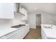 Modern kitchen featuring white cabinets, stainless steel appliances, quartz countertops and a subway tile backsplash at 577 Dalton Way, Avon, IN 46123