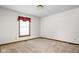 The bedroom boasts a window for natural light, soft carpeting, and neutral paint at 5905 N County Rd 600 E, Brownsburg, IN 46112