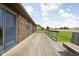 The wooden deck features a grassy backyard with a view at 5905 N County Rd 600 E, Brownsburg, IN 46112