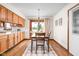 Cozy dining room with wood floors, pendant lighting, and access to the backyard through a sliding glass door at 5905 N County Rd 600 E, Brownsburg, IN 46112