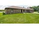Charming brick home featuring a lush lawn and well-maintained landscaping at 5905 N County Rd 600 E, Brownsburg, IN 46112