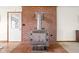 Unique wood-burning fireplace with brick surround, adding warmth and character at 5905 N County Rd 600 E, Brownsburg, IN 46112