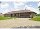 View of the brick home with a spacious two-car garage and concrete driveway at 5905 N County Rd 600 E, Brownsburg, IN 46112