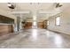 The spacious garage includes windows for natural light and built-in cabinetry at 5905 N County Rd 600 E, Brownsburg, IN 46112