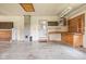 The garage features built-in cabinetry and a work bench and an exterior door at 5905 N County Rd 600 E, Brownsburg, IN 46112