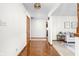 Hallway with hardwood floors connecting to living spaces, creating an inviting flow at 5905 N County Rd 600 E, Brownsburg, IN 46112