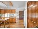 Kitchen features wooden cabinets, white appliances, white countertop and a white tile backsplash at 5905 N County Rd 600 E, Brownsburg, IN 46112