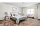 Comfortable main bedroom with neutral décor, carpet, and a large window at 5905 N County Rd 600 E, Brownsburg, IN 46112