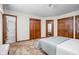 Main bedroom with multiple closets, carpet, and neutral colors at 5905 N County Rd 600 E, Brownsburg, IN 46112