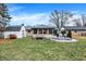 Large backyard with a deck, screened-in porch, storage shed, and plenty of green space at 634 Park Dr, Greenwood, IN 46143