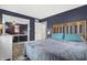 A large bedroom with a ceiling fan, mirrored closet, and neutral paint color at 634 Park Dr, Greenwood, IN 46143