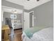 Neutral toned bedroom with a queen bed and closet with mirrored doors at 634 Park Dr, Greenwood, IN 46143