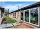 Charming brick home with a cozy patio, mature landscaping, and modern double-hung windows at 634 Park Dr, Greenwood, IN 46143