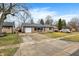 Well-kept home with a long driveway, attached garage, and established landscaping at 634 Park Dr, Greenwood, IN 46143