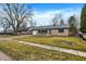 Spacious single-story house featuring a brick front, driveway, and well-maintained lawn at 634 Park Dr, Greenwood, IN 46143