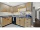 A kitchen with updated cabinetry and backsplash, stainless steel appliances and laminate countertops at 634 Park Dr, Greenwood, IN 46143