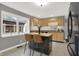 A kitchen featuring a stone tile floor, stainless steel appliances, and an island with granite countertop and seating at 634 Park Dr, Greenwood, IN 46143