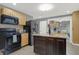 A kitchen featuring a tile floor, wood cabinets, stainless steel appliances and an island with granite countertops at 634 Park Dr, Greenwood, IN 46143