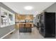 Well-lit kitchen featuring an island with seating, stainless steel appliances and modern countertops and cabinets at 634 Park Dr, Greenwood, IN 46143