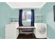 Laundry room featuring new appliances, a folding table, and shelving at 634 Park Dr, Greenwood, IN 46143