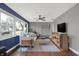 Open living room with hardwood floors, neutral tones, and a modern ceiling fan at 634 Park Dr, Greenwood, IN 46143