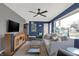 Comfortable living room with a ceiling fan, stylish furniture, and a gray accent wall at 634 Park Dr, Greenwood, IN 46143