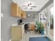 A well-lit office space with laminate countertops, tile floor and a walkout to the patio at 634 Park Dr, Greenwood, IN 46143