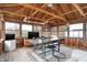 Charming sunroom with wood plank floors, dining table, ceiling fan, and multiple windows at 634 Park Dr, Greenwood, IN 46143