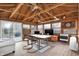 Cozy sunroom features a wood ceiling, a dining area, and an abundance of natural light at 634 Park Dr, Greenwood, IN 46143