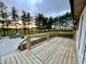 Wooden back deck showing sunrise over the trees at 6593 N 800 W, Elwood, IN 46036