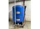 Blue water pressure tank with gauges and connectors ensuring efficient plumbing system at 6593 N 800 W, Elwood, IN 46036
