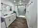 Bathroom featuring a double sink vanity, ample storage, and a spacious shower at 6593 N 800 W, Elwood, IN 46036