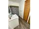 Bathroom features a vanity, tile shower, and hardwood floors at 6593 N 800 W, Elwood, IN 46036
