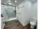 Bathroom featuring a toilet, shower, and ample space at 6593 N 800 W, Elwood, IN 46036