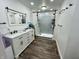 Bathroom featuring a double sink vanity, ample storage, and a spacious shower at 6593 N 800 W, Elwood, IN 46036