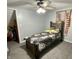 Comfortable bedroom featuring a ceiling fan, closet, and neutral walls at 6593 N 800 W, Elwood, IN 46036