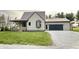 Charming two-story home featuring a metal roof and an attached two car garage at 6593 N 800 W, Elwood, IN 46036