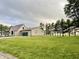 Charming two-story home featuring a metal roof and an attached two car garage and plenty of trees at 6593 N 800 W, Elwood, IN 46036