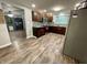Spacious kitchen featuring stainless steel appliances, dark wood cabinets, and hardwood floors at 6593 N 800 W, Elwood, IN 46036