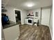 Laundry room features appliances and hardwood floors at 6593 N 800 W, Elwood, IN 46036
